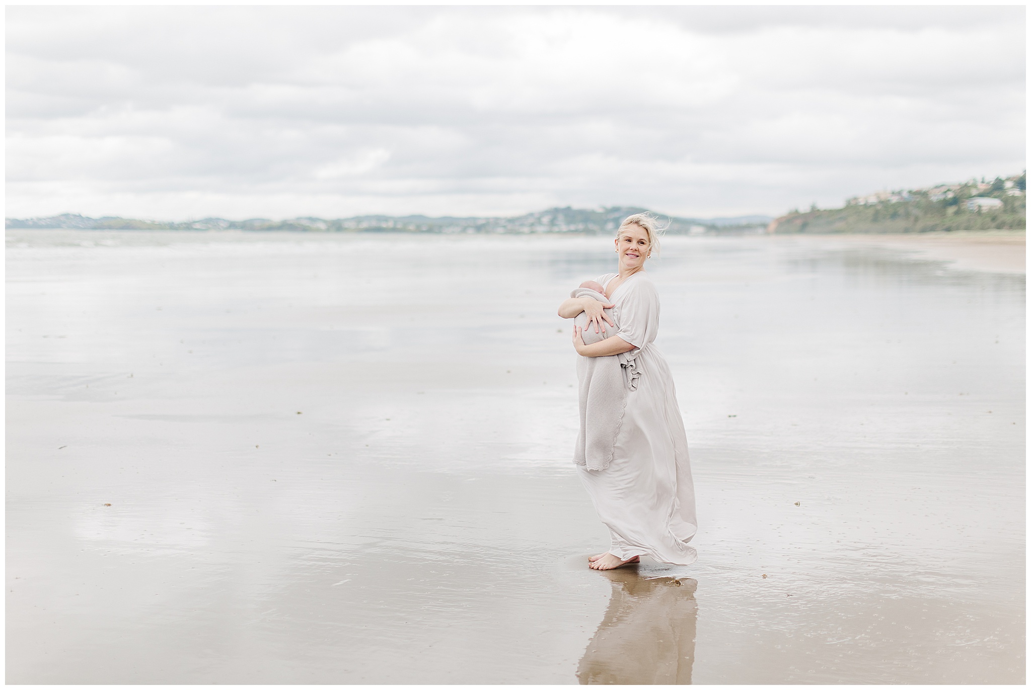 Mum and her new baby on Yeppon beach by alyce holzy photography