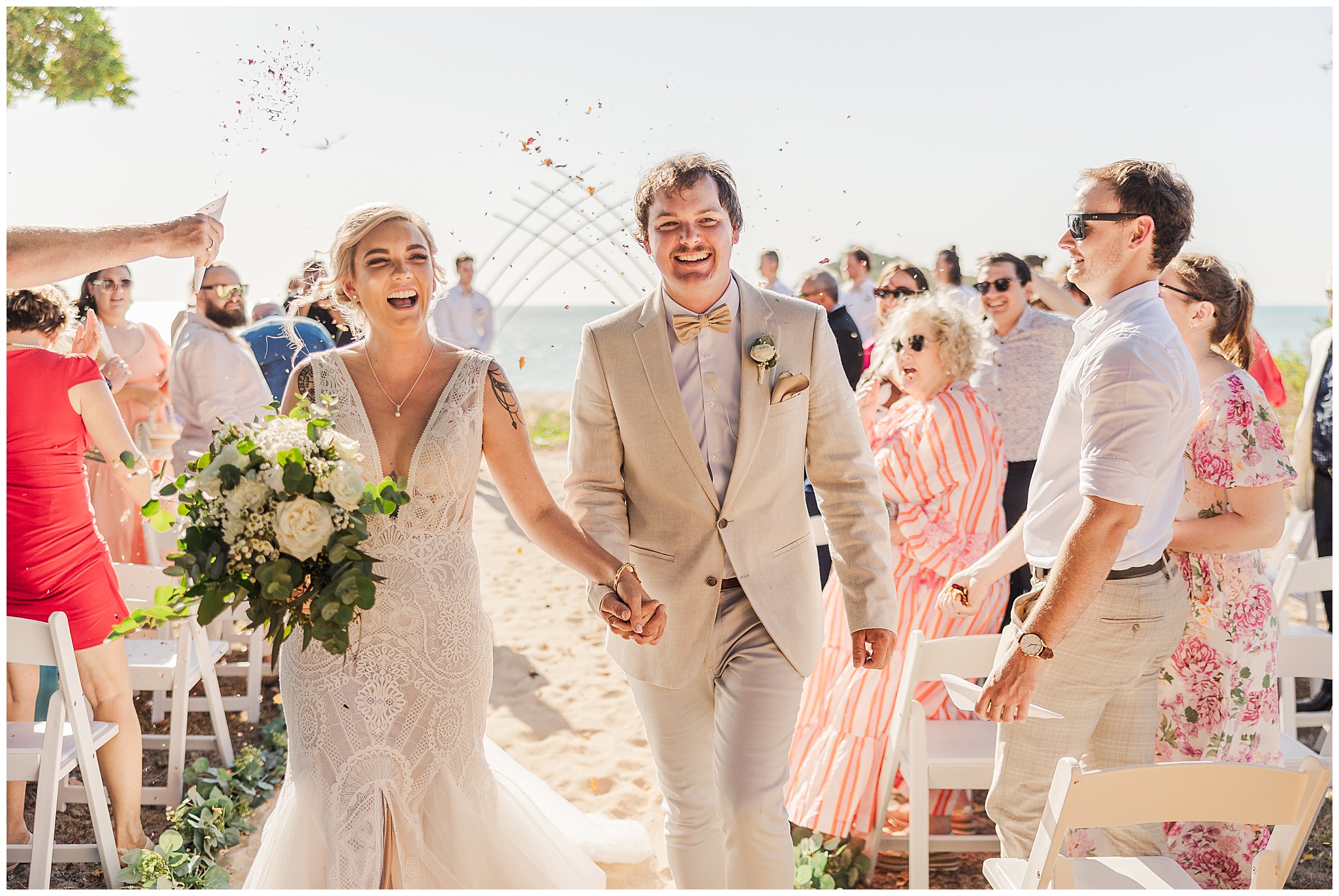 bride and groom recessing down the aisle on their Cape Gloucester Resort wedding day.