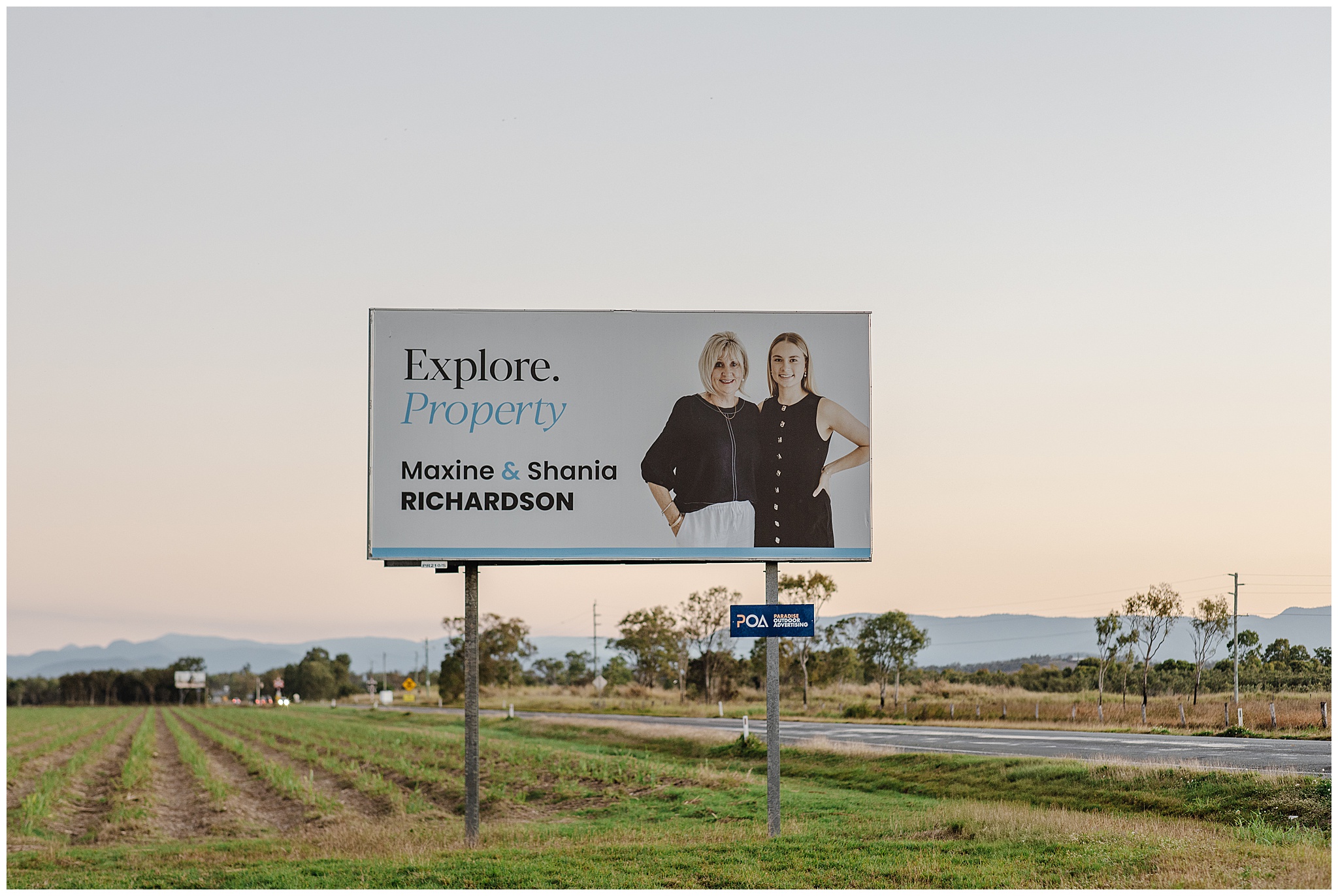 Maxine and Shania Richardson using their branding session on a billboard.