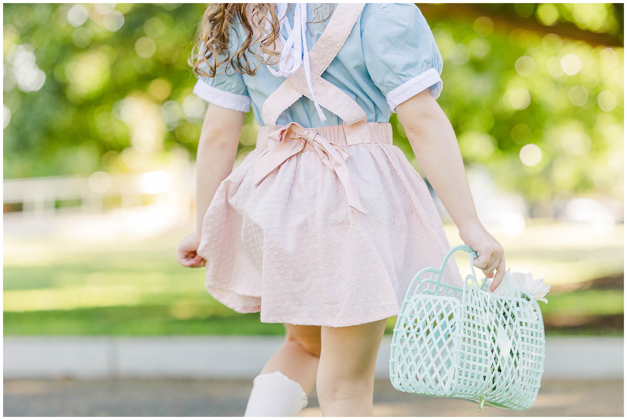 Alyce Holzy a kids fashion brand photographer takes detailed shots of product for Saint Odette.