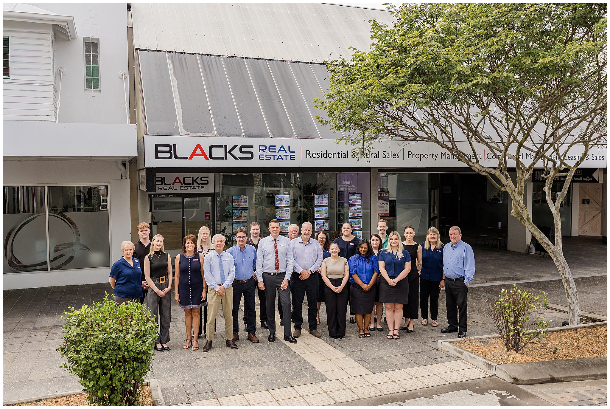Professional outdoor headshots of a real estate team in Mackay, captured for branding and marketing purposes.