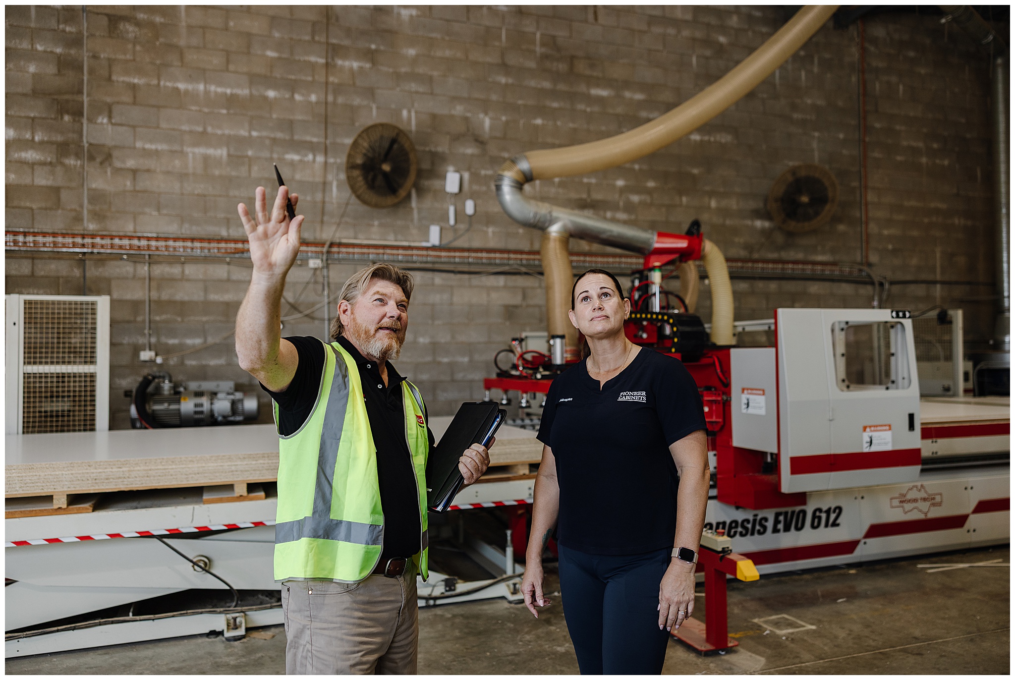 Elders Insurance agent with commerical client in workshop.